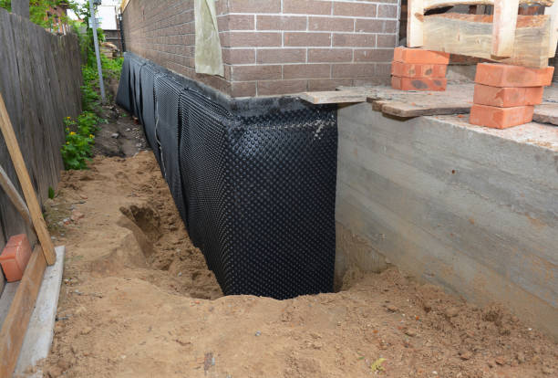 Happy homeowners after waterproofing job in Locust Grove